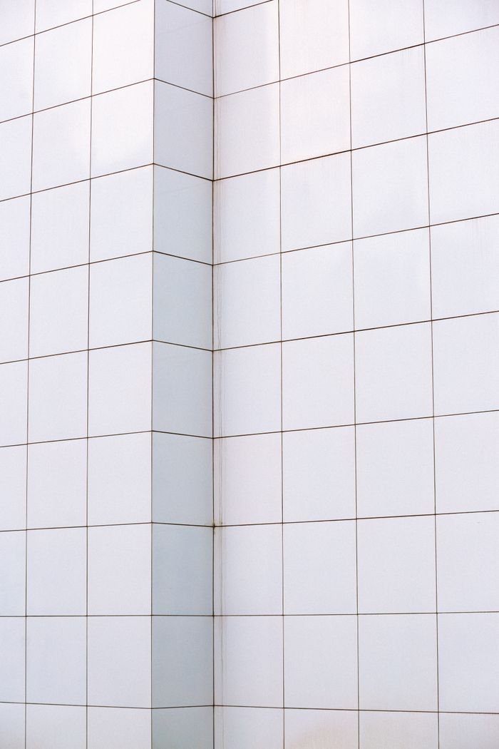 Minimalist white tiled wall corner design in Atlanta, GA.